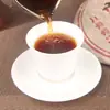 Té Pu'er de Yunnan al por mayor 2006 Montaña Marrón palacio té Pu'er cocido primavera pastel de siete semillas