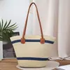 Bolso cruzado para mujer ins nuevo simple y moderno tejido de paja gran capacidad axila hombro tejido hueco bolsa de playa para mujer