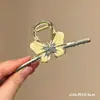 Pinzas para el cabello de alta gama para mujer para la parte posterior de la cabeza, exquisitas pinzas de garra de perla para el día a día, elegantes pinzas de tiburón para salir, venta al por mayor de artículos pequeños de Yiwu