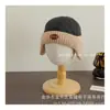 2024 nuevo gorro acolchado de invierno a cuadros con protección para las orejas para niños y niñas Joker cálido gorro Lei Feng gorro melón venta al por mayor