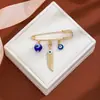 Broche de Borla Ojo del Diablo con Pedrería Creativa Europeo y Americano para Mujer, Pin de Estilo Vintage para Ceñir la Cintura de Suéter Ojo Azul de Alta Gama