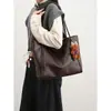 Bolso de hombro versátil para mujer, simple y espacioso, de la nueva colección 2026, con un aspecto sofisticado, adecuado para uso casual y para ir al trabajo, y también se puede llevar como bolso de mano.
