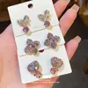 Brincos de Agulha de Prata Luxo Leve Flor de Trevo de Quatro Folhas Pétala Laço de Diamante Personalidade Nicho Elegante High-end para Mulheres