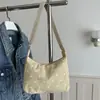 Bolso de mano plisado de estilo moderno y dulce para mujer, nueva colección de verano 2026, tela de pana con lunares, bolso de hombro versátil y bolso de axila