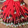 Venta al por mayor de fábrica cuerda roja cuerda amarilla Wudi Qian Xiangyun accesorios para llavero de cuerda accesorios de metal de latón colgante para llavero