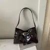 Otoño 2026 Gran Capacidad Nueva Moda Hebilla de Pin de Alta Calidad Diseño de Nicho Elegante Versátil Bolso de Hombro de Mano