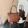 Elegante bolso de mano para mujer 2026 nuevo verano exquisito patrón tejido bandolera bandolera cubo para el día a día