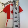 Souvenir de la Copa Mundial 2026 de EE. UU., Canadá y México Llavero de Jersey Suave de PVC Colgante para Aficionado con Bandera Canadiense