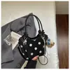 Bolsa de mano, bolso de hombro, bolsa tote, bolsa de trabajo, bolsa tipo cubo versátil, nuevo diseño de lunares de nicho estilo coreano, Primavera/Verano 2026