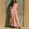 Colección de otoño 2026 europea y americana: Vestido largo blanco de alta gama, ajustado en la cintura, corte holgado, ropa para mujer talla grande, un artículo popular para ventas transfronterizas