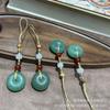Grasa de oveja de Xinjiang jade blanco Jade Dorado hebilla de seguridad colgante multifuncional Jade Dongling natural Hebilla de pan joyería para colgar en el teléfono móvil