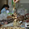 Sino de Noz Sino de Mão Sino dos Ventos Pendurado em Bolsa Sino Sonoro Artesanal Pingente Casca de Fruta Preta Indonésia Fábrica Atacado