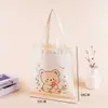 Bolsa de lona de dibujos animados en stock, bolsa de hombro alta personalizada, bolsa de algodón para compras y uso diario de estudiantes, logo personalizado