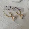 Pendientes de perlas de línea retorcida de nueva moda 2022 para mujer, únicos, ligeros, de lujo, de alta gama, elegantes, de celebridades de Internet.