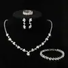 Accesorios de novia sencillos de moda transfronteriza 2024: collar, pendientes, pulsera y anillo de diamantes de imitación dorados.