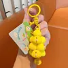 Popular criativo fofo animal de estimação jengle jardim boneca desenho animado casal mochila pingente chaveiro de carro pequeno presente atacado