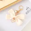 Nuevo Colgante Creativo de Cadena Colgante con Lazo de Perlas para Bolso, Funda de Teléfono, Llavero, Adorno, Exquisito Accesorio de Regalo Pequeño