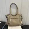 Bolso informal de tela de gran capacidad, nueva moda principios de otoño 2026, ligero, simple, versátil, elegante para llevar al hombro, cruzado y como bolso de mano