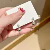 Pendientes de Botón Pequeños de Plata con Perla de Doble Uso, Estilo Popular para Mujer, Nuevo Diseño de Nicho 2026 con un Toque de Alta Gama y Elegante