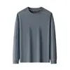 Camiseta básica de manga larga con cuello redondo para hombre, una prenda casual moderna y versátil para primavera y otoño, con un diseño de bloques de color