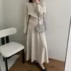 Fotos reales de ropa de mujer de Dongdaemun, Corea del Sur: Novedades de alta calidad para otoño de 2026, con un elegante conjunto de punto ajustado y falda a juego