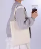 Bolsas de lona en stock para la temporada de regreso a clases, personalizables con logo y diseño, bolsas de regalo gruesas de alta gama
