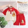 Camiseta de solapa estilo caricatura para niños 2023 conjunto de dos piezas de pantalones cortos de verano para bebé y niños nuevo producto venta al por mayor de fábrica