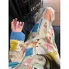 Pijama lindo de estilo coreano con estampado de dibujos animados y retazos para mujer, conjunto de ropa de estar de manga larga y pantalón largo de talla grande para principios de otoño, adecuado para usar en exteriores