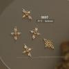Explosiones de red de celebridades Buchelati arte de uñas joyería de circón estrellas aleación de cuatro hojas hueco diamante accesorios para uñas al por mayor