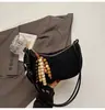 Bolsa de Axila Estilo Dumpling Retro Design de Nicho Transfronteiriço para Mulheres 2025 Nova Bolsa de Ombro Único Transversal Simples e Estilo Ocidental de Alta Qualidade