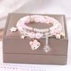 Libro de Caperucita Roja con Pulsera de Cuentas de Palomitas de Estudiante al por Mayor Pulsera de Cristal de Dibujos Animados de Siete Colores Cajas de Regalo para Novias