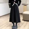 ¡Contrarresta el pedido! ¡Falda de botón tridimensional estilo Hepburn! Tela de lana europea otoño e invierno falda larga elegante para mujer