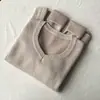 Suéter de punto blanco con cuello en V para mujer, nuevo estilo otoño e invierno 2025, forrado de felpa, engrosado, corte ajustado, top base favorecedor