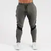 Novas calças esportivas masculinas transfronteiriças para corrida, fitness e uso casual, com cordão, calças de treino justas, calças casuais elásticas, corte slim