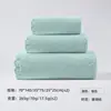 Fornecimento transfronteiriço toalha de banho de fleece coral com borda cortada embalagem a vácuo disponível absorção de água secagem rápida etiquetagem toalha de cor lisa estampa LOGOTIPO