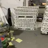 Tela punzonada con aguja anti-pluma en stock, anti-pluma, anti-penetración, material de forro para chamarra de plumas transpirable, tela punzonada con aguja anti-pluma