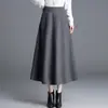 Nova saia feminina simples de cor sólida elegante 2026 outono cintura alta modeladora barra larga que cobre o quadril saia longa evasê moderna