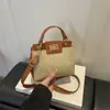 Bolsa de Ombro Transversal Elegante de Tecido com Textura Retrô Simples Versátil de Alto Valor Nova Moda Verão 2026
