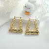 Pendientes transfronterizos de moda europea y americana de alto sentido, pendientes de acero inoxidable en oro de 18 quilates con temperamento circular para damas, de acero de titanio que combinan con todo.