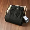 Nueva colección de otoño: Pantalones de hombre de alta gama, texturizados, sin elasticidad, con corte recto holgado y confeccionados con algodón de fibra larga para un ajuste cómodo y casual.