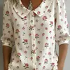 Nova Camisa Europeia e Americana Cruzada Amazon Primavera/Verão 2026 Solta Casual Vintage Botão Bordado Floral Manga Média