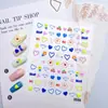 Pegatinas populares de mariposas coloridas de dibujos animados para decoración de uñas, diseños de corazón y flor de color sólido en relieve 5D, alto valor estético para decoración de uñas