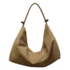 Bolso tote de color sólido con diseño único, estilo coreano ins, nuevo para mujer, bolso cruzado ligero y de gran capacidad para ir al trabajo.