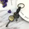 Llavero creativo punk para hombre y mujer, pequeño regalo, brújula de aleación, llavero de cuero tejido vintage, colgante para llaves