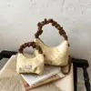Bolso pequeño de lunares estilo coreano transfronterizo para niñas, nuevo bolso de mano plisado para principios de otoño de 2026, bolso cruzado y de hombro mini versátil
