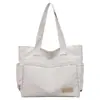 Bolsa de Lona Estética de Alto Valor para Mulheres, Grande Capacidade, Bolsa de Ombro para Estudantes, Bolsa de Mão Portátil, Novo Estilo Tendência Primavera/Verão 2026
