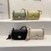 Bolso de Silla de Diseño de Nicho de Gama Alta 2026 Verano Nuevo Bolso de Hombro con Cinta Estilo Fresco para Mujer