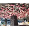 Ramas de flor de cerezo flor de durazno falsa plantas verdes de techo decoración enredaderas de flores de interior pared de celebridad de internet supermercado restaurante habitación cubierta superior fealdad