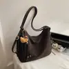 Bolsa de Ombro Nova Estilo Primavera 2026 Retrô Fashionável e Elegante de Aparência Sofisticada para Trabalhadores de Escritório no Trajeto Bolsa Tote Retrô