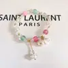 Nueva pulsera de esmalte de mariposa femenina ins nicho lujo ligero Mori azul marino cuentas de colores craqueladas hielo pulsera de amigas al por mayor